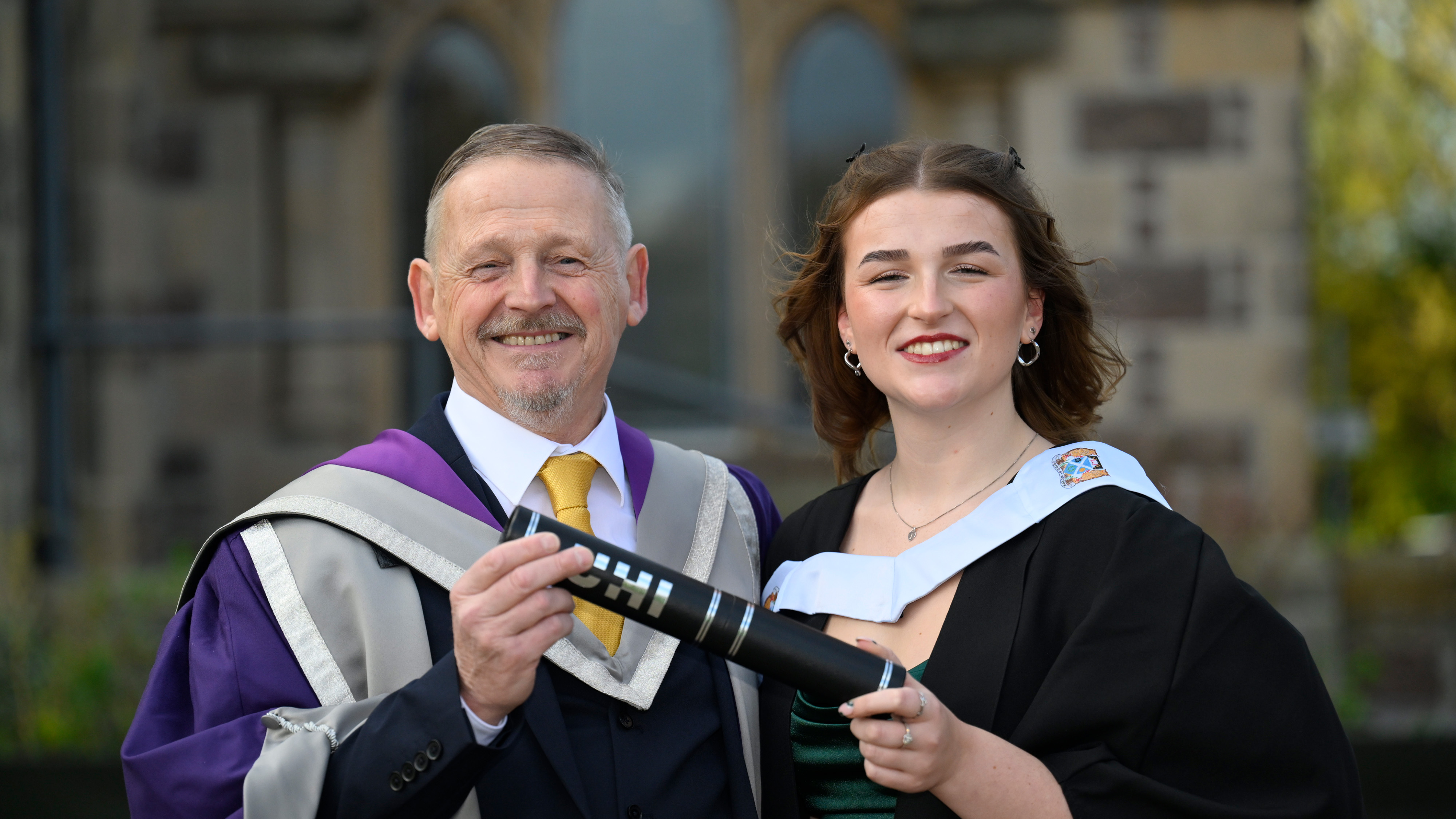 Patrick and Dorothy Mullery holding a scroll Patrick and Dorothy Mullery holding a scroll
