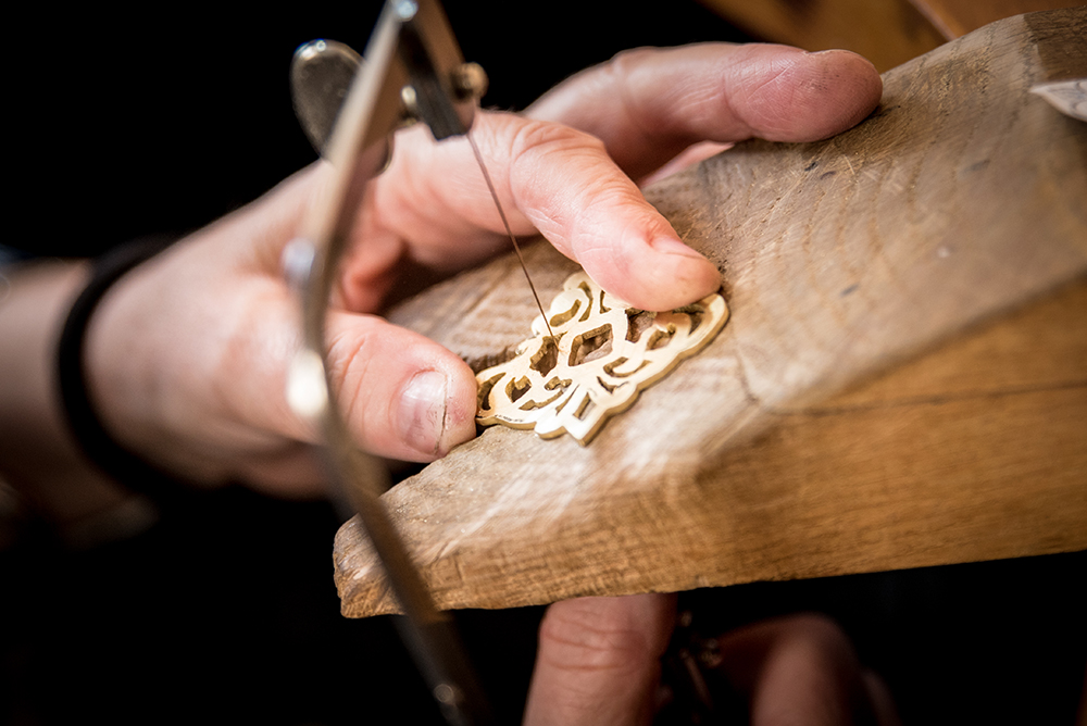 Hands making jewellery Hands making jewellery