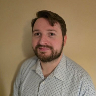 a student smiling at the camera