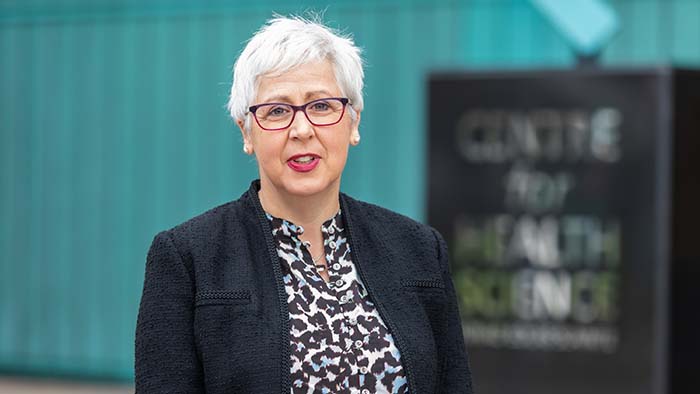 Professor Nicola Carey standing outside UHI House smiling at the camera Professor Nicola Carey standing outside UHI House smiling at the camera