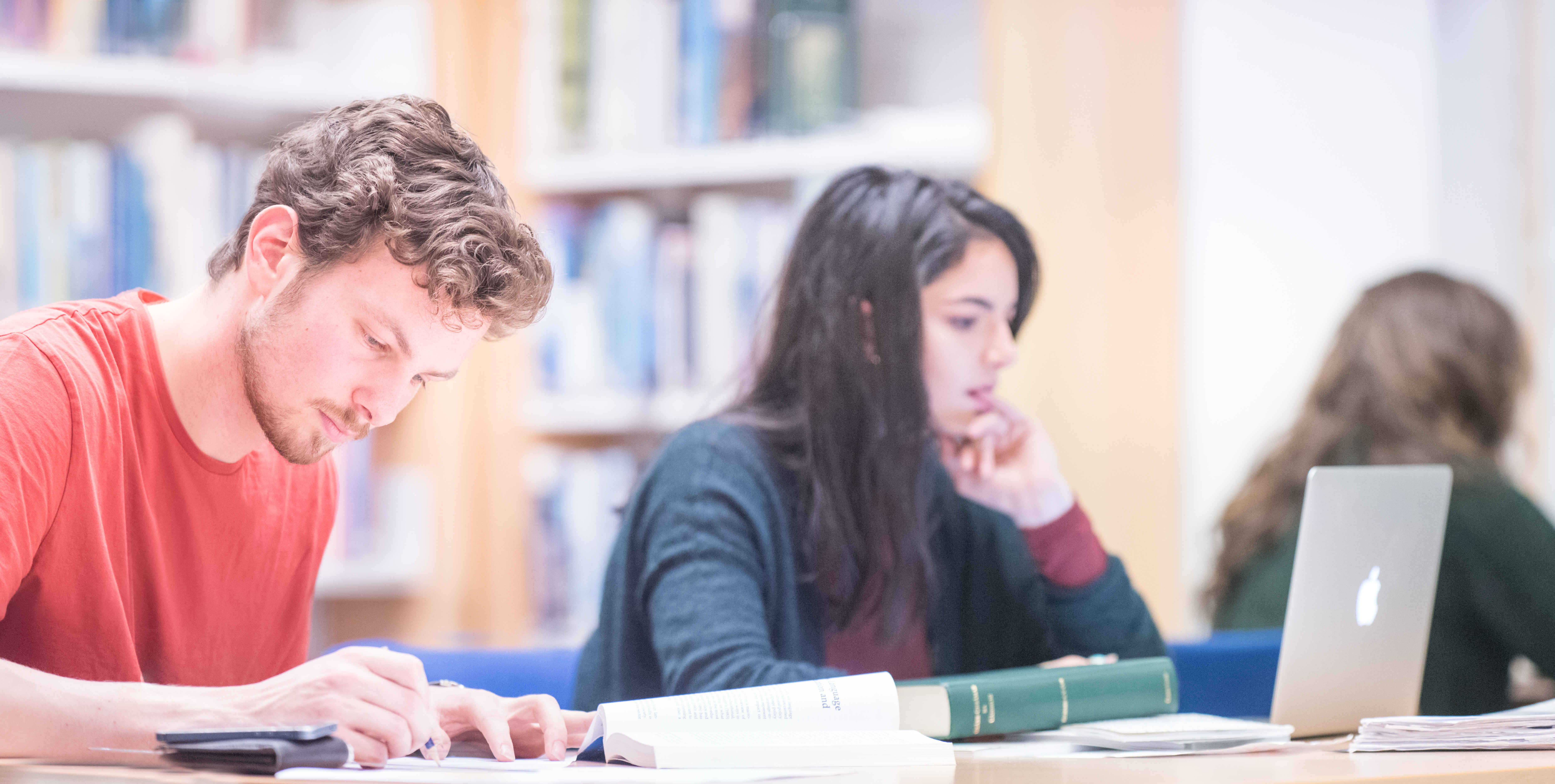 Students in a library Students in a library
